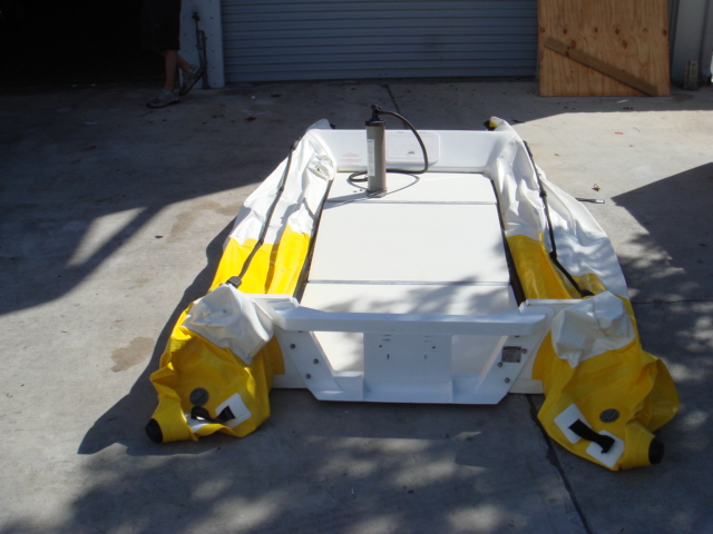 Boat shown deflated prior to being rolled up for storage or easy transport, as senn in the following image